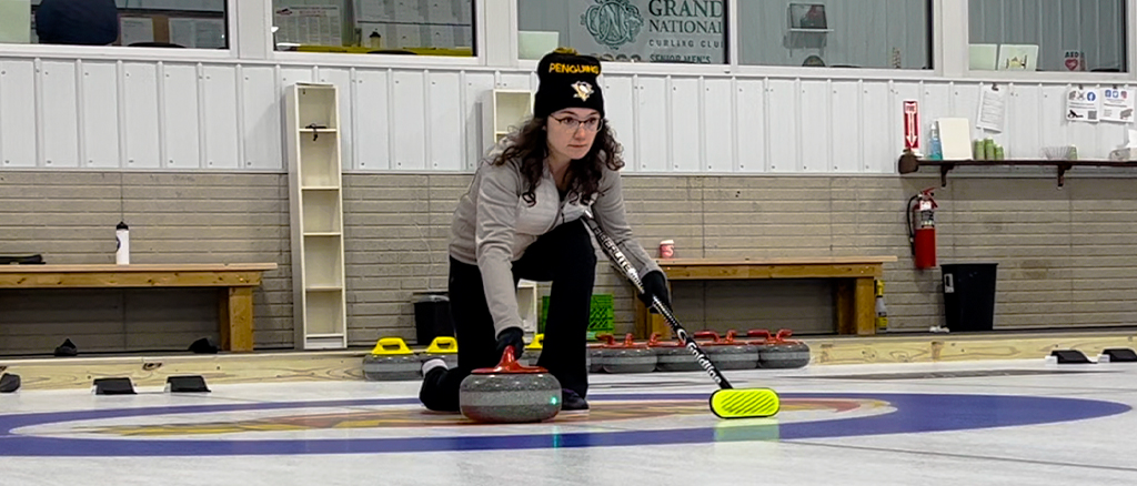 Curling in action sliding across the ice